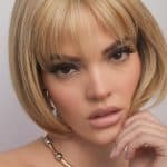Blonde bob wig with side-swept bangs from Hidden Secrets Wigs.